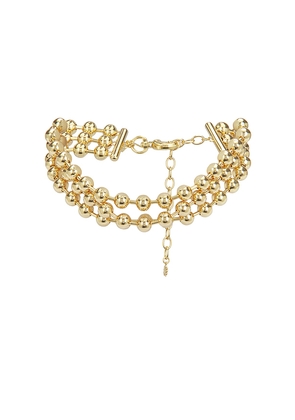 Lele Sadoughi Diana Triple Row Necklace in Metallic Gold.
