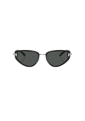 Tory Burch Oval Sunglasses in Black.