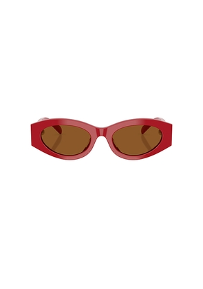 Tory Burch Oval Sunglasses in Red.