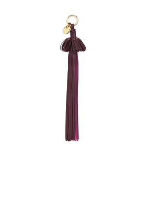 Ulla Johnson Pom Tassel Leather Charm in Burgundy.