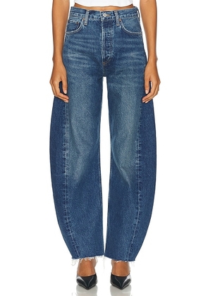 AGOLDE Luna Pieced High Rise Curved Taper Jeans in Split - Denim-Medium. Size 23 (also in 24, 25, 26, 27, 29).