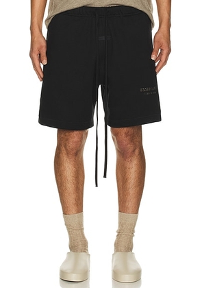 Fear of God ESSENTIALS Soccer Fleece Shorts in Jet Black - Black. Size L (also in ).