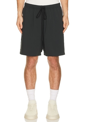 Fear of God ESSENTIALS Classic Short in Vintage Black - Black. Size L (also in XS, S, M, XL/1X, XXL/2X).