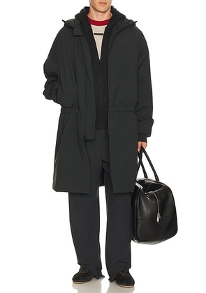 Fear of God ESSENTIALS Hooded Parka in Vintage Black - Black. Size L (also in S, M, XL/1X).