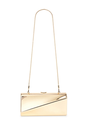 SIMKHAI Twist Clutch in Metallic Gold.