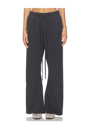 Fear of God ESSENTIALS Flare Sweatpant in Black. Size L. Also in XS, S, M, XL.