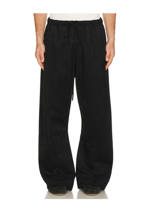 Fear of God ESSENTIALS Flare Pant in Black. Size L. Also in XS, S, M, XL/1X, XXL/2X.