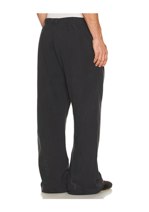 Fear of God ESSENTIALS Flare Sweatpant in Black. Size L. Also in XS, S, M, XL/1X, XXL/2X.