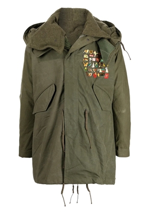 Readymade pin-embellished fishtail parka - Green