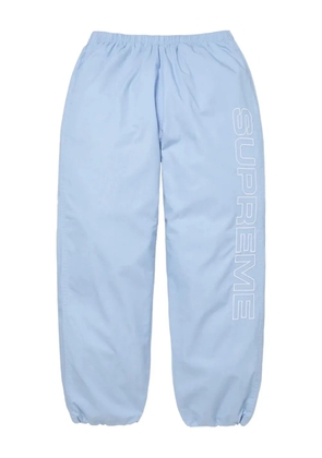 Supreme logo-print track trousers - Blue