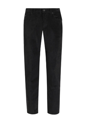 Dolce & Gabbana corduroy logo-plaque trousers - Black
