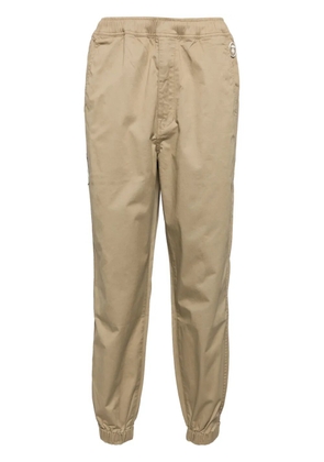 AAPE BY *A BATHING APE® Moonface logo pants - Neutrals