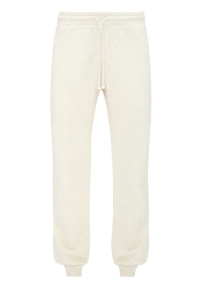 JW Anderson slogan-embroidered cotton track pants - White