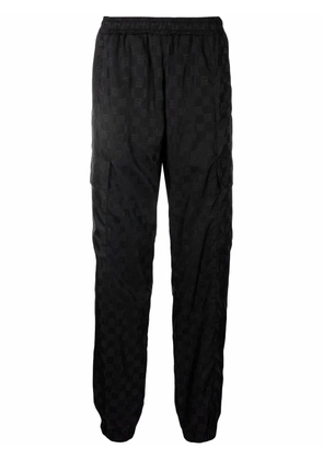 MISBHV monogram-print trousers - Black