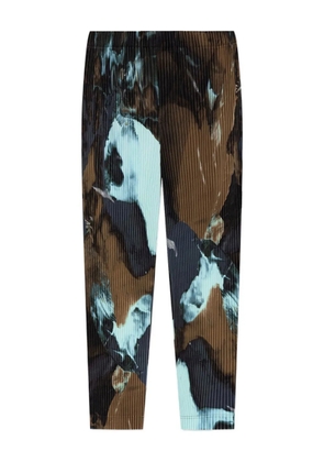 Homme Plissé Issey Miyake pleated abstract-print trousers - Brown