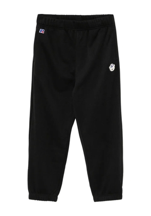 CHOCOOLATE x Russell Athletic bear-embossed trousers - Black