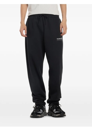 New Balance logo-print track pants - Black