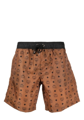 MCM logo-monogram print swim shorts - Brown