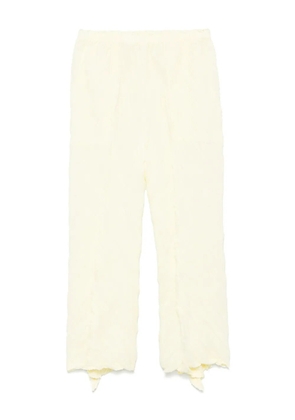 Issey Miyake wrinkled twisted trousers - Yellow