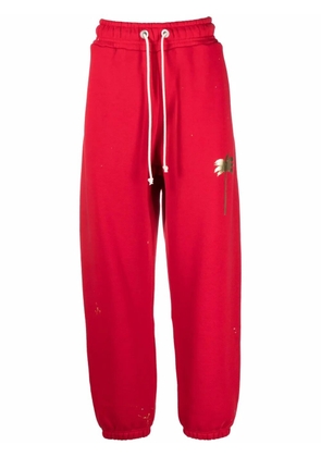 Palm Angels palm tree-print track pants - Red