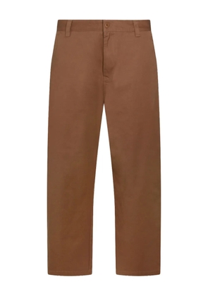 Carhartt WIP buttoned logo-patch trousers - Brown