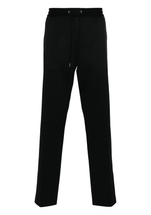 Moncler logo-patch drawstring tapered trousers - Black