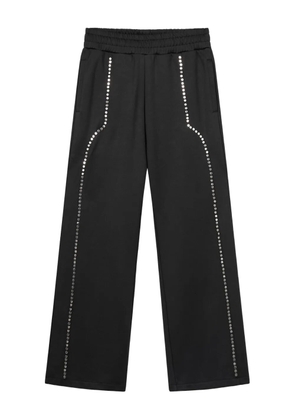 ROUGH. studded-detail trousers - Black