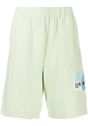 Undercover house print wide-leg shorts - Green