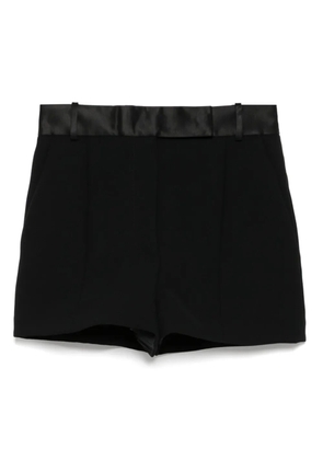 KHAITE double-pleat flared shorts - Black