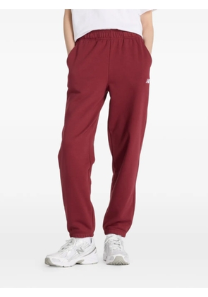 New Balance drawstring-fastening logo-detail track pants - Red