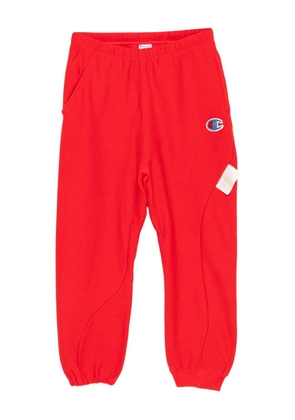 Undercover logo-patched track pants - Red