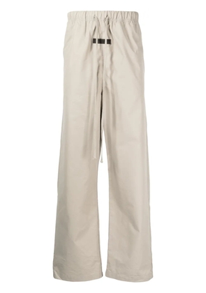 FEAR OF GOD ESSENTIALS logo-patch straight-leg trousers - Green