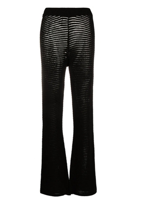 Nanushka Bazia crochet-knit slim trousers - Black
