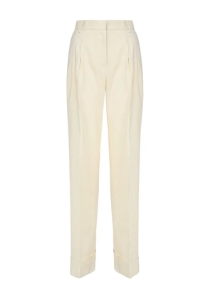 THE ANDAMANE pleated-front cuffed-hem trousers - Yellow