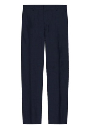 AMI Paris pressed-crease tapered trousers - Blue