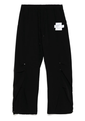 Musium Div. logo-patch trousers - Black