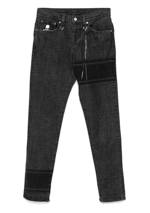Mastermind World logo-embroidered skinny jeans - Black