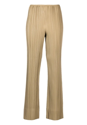 Nanushka Emae pleated faux-leather trousers - Neutrals