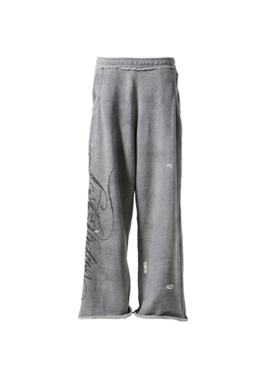 LOSTSHDWS distressed-script track pants - Grey