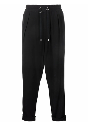 Balmain slouchy crepe tapered-leg track pants - Black