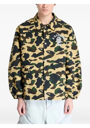 A BATHING APE® logo-print camouflage-pattern jacket - Yellow