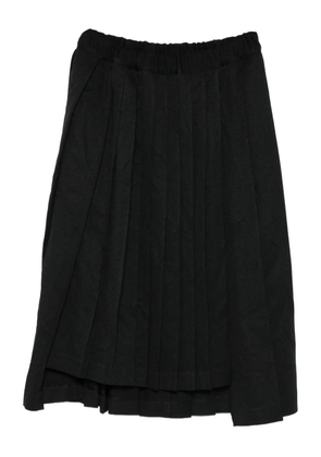 Black Comme Des Garçons pleated skirt