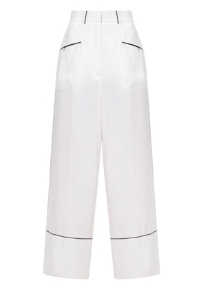 A.M.G. piped-trim trousers - White