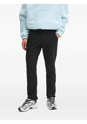 Timberland logo-patch side-pocket trousers - Black