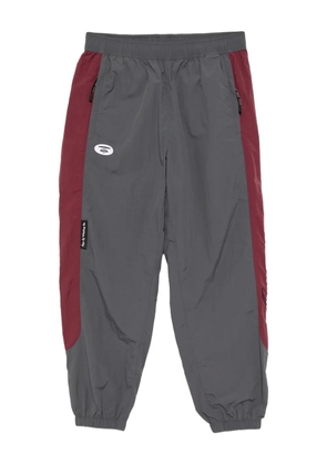 AAPE BY *A BATHING APE® logo-embroidered trousers - Grey