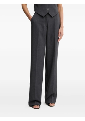 GUESS USA metal-plaque trousers - Grey