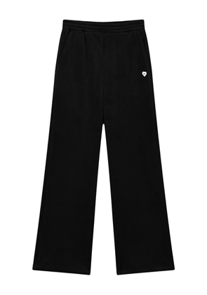 CHOCOOLATE heart-emblem ribbed trousers - Black