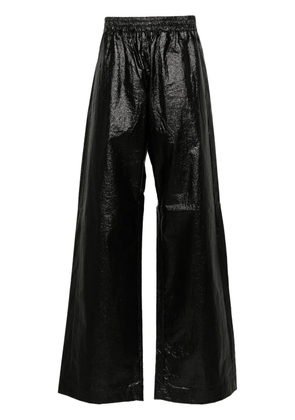 Walter Van Beirendonck embroidered-logo trousers - Black