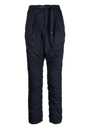 Undercover logo-tag buckle-fastening tapered trousers - Blue