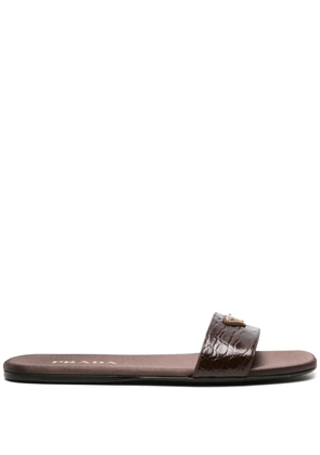 Prada triangle-logo embossed-crocodile slides - Brown